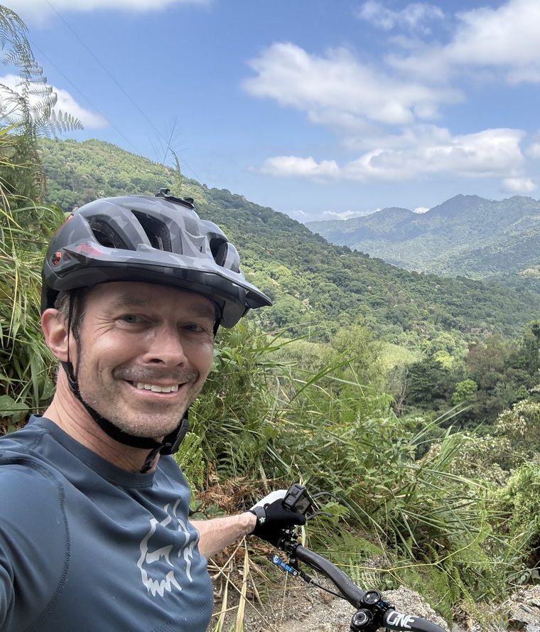 Will Yandell mountain biking on a trail in Colombia